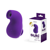 A purple "VeDO Suki - Purple Air Suction Clit Stimulator" from VeDO is displayed against a white background. The ergonomic device, featuring control buttons and a curved design for optimal comfort, offers multiple vibrating suction modes. The packaging box shows an image of the product and highlights key features.